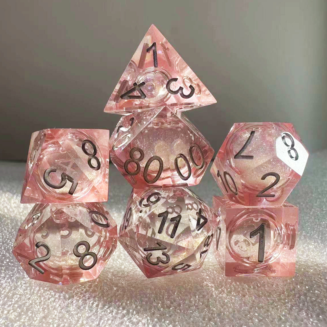 Pink romantic resin liquid core dnd dice set.