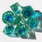 Blue liquid core dnd resin dice with green font for games