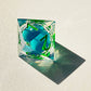 Blue liquid core dnd resin dice with green font for games