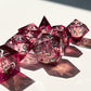 Glittering liquid core dice set for role playing games , pink red liquid core dice set